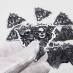 Mirror chrome die-cut stickers handled on a white sweep