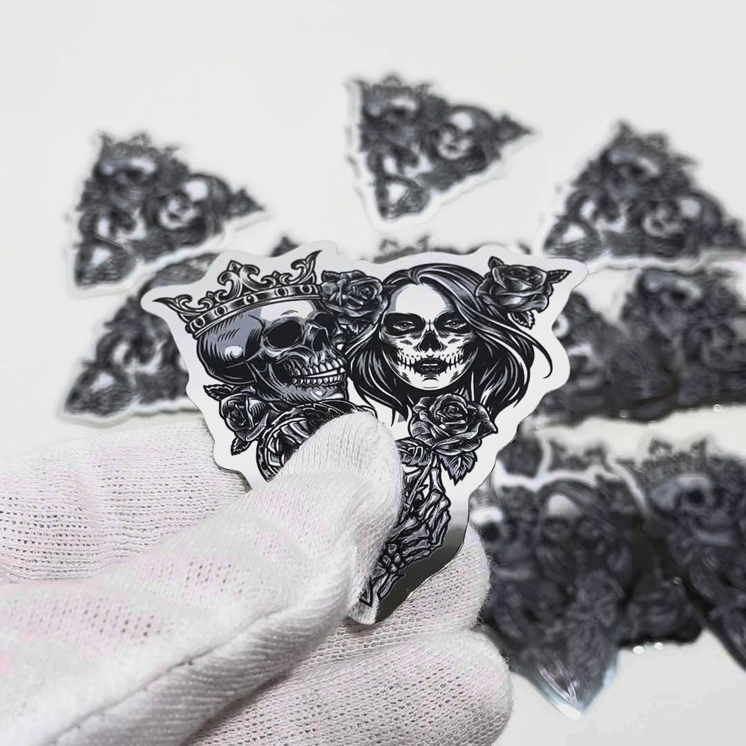 Mirror chrome die-cut stickers handled on a white sweep
