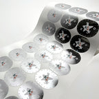 Roll of round labels printed on metallic silver