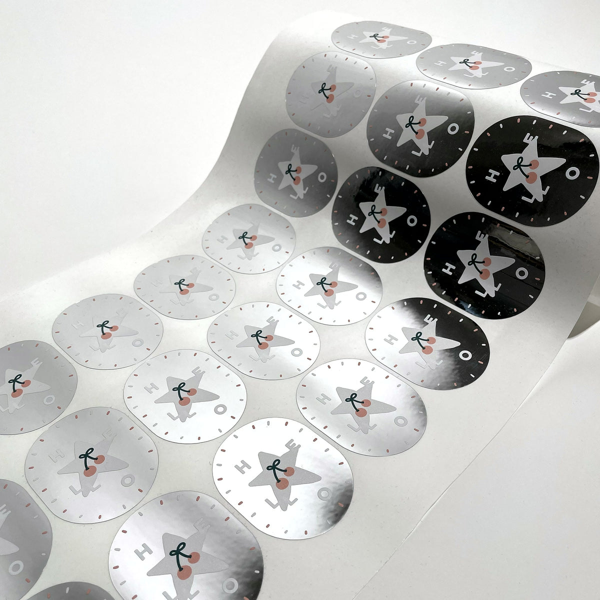 Roll of round labels printed on metallic silver