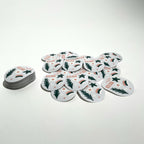Round white matte labels laid out flat