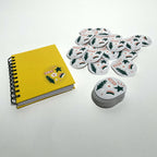 White matte round labels next to a notebook